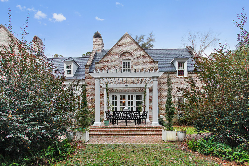 Example of a mid-sized classic two-story brick exterior home design in Atlanta