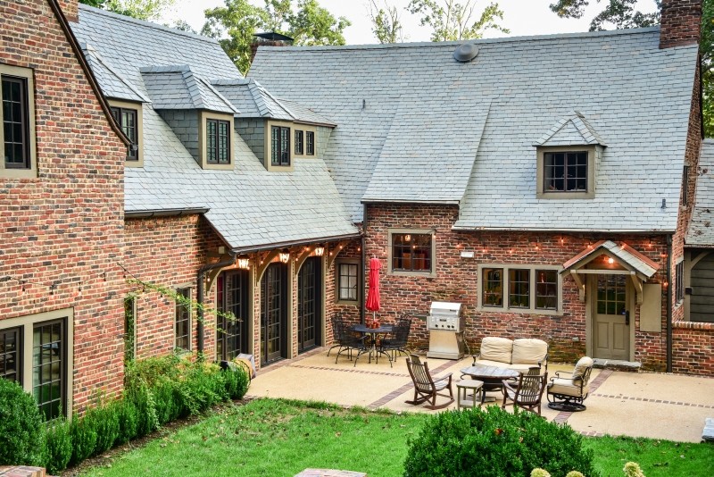 Mid-sized elegant red two-story brick exterior home photo