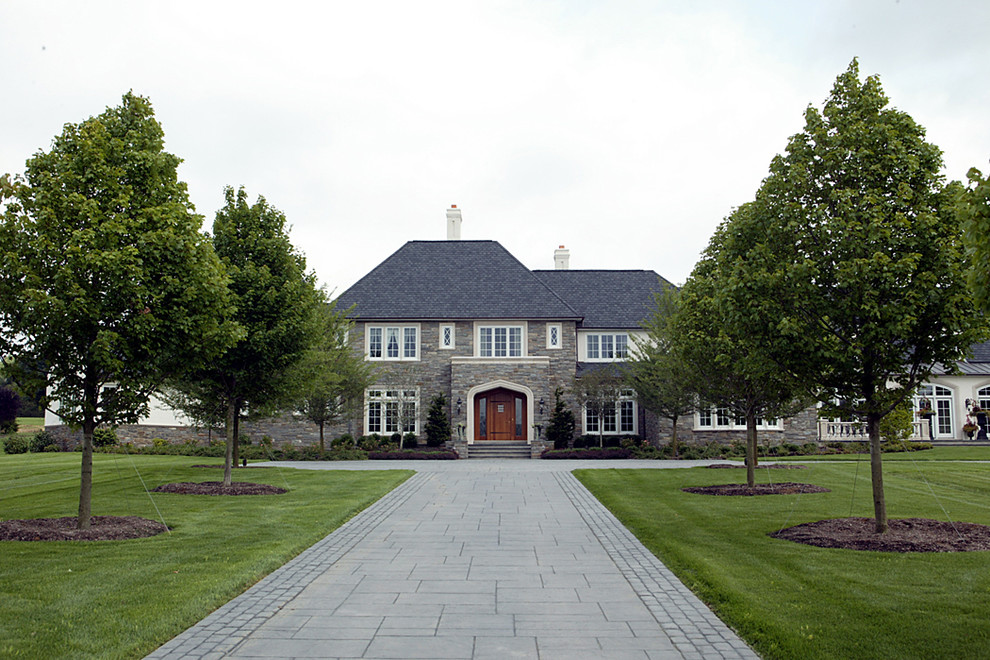 Example of a large classic two-story stone exterior home design in Philadelphia