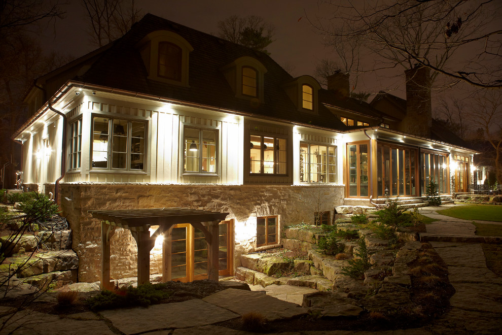 Example of a huge classic beige three-story mixed siding exterior home design in Toronto
