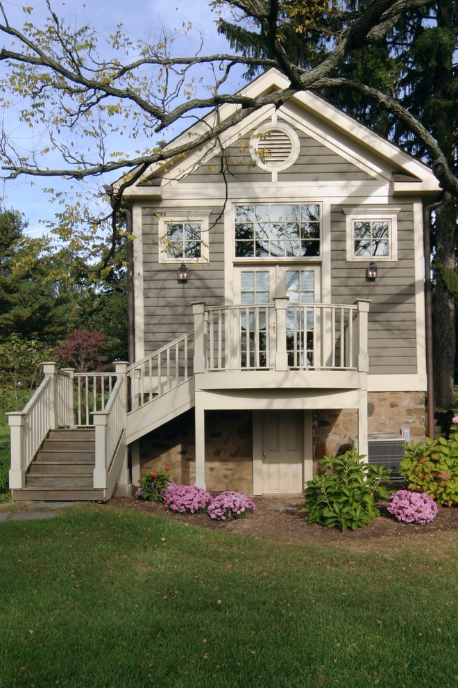Photo of a traditional house exterior in Philadelphia with wood cladding.