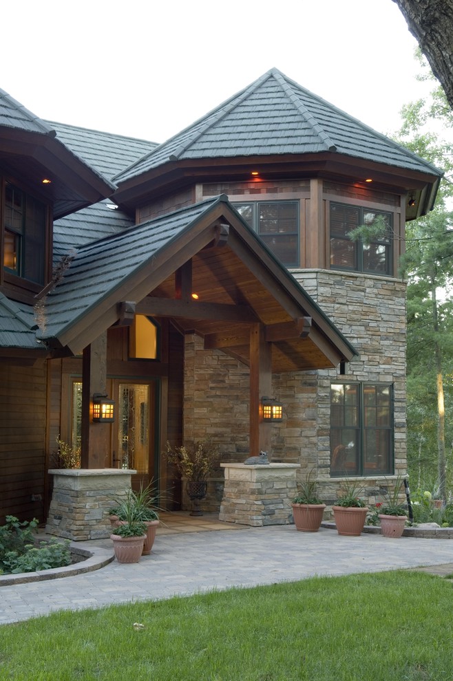Inspiration for a rustic stone exterior home remodel in Minneapolis