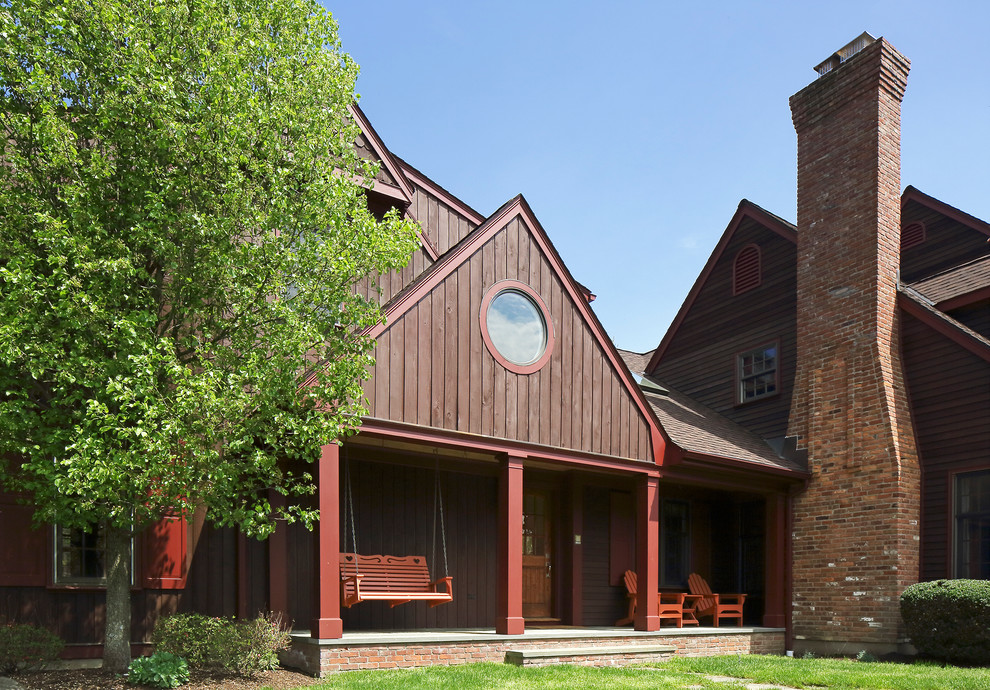 Example of a farmhouse exterior home design in New York