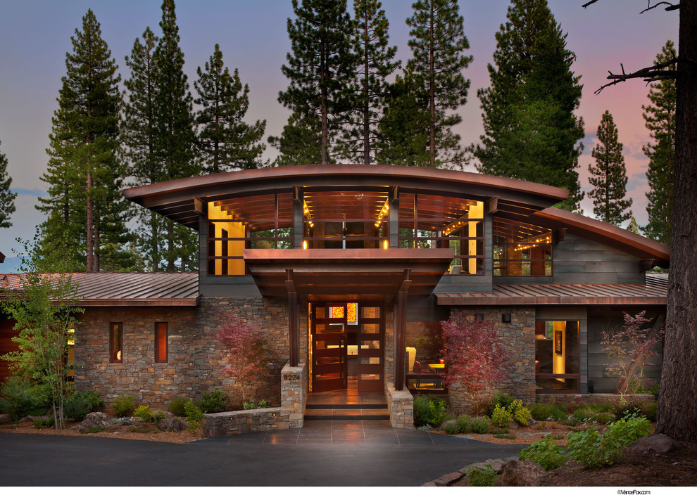 Inspiration for a rustic two-story stone exterior home remodel in Sacramento