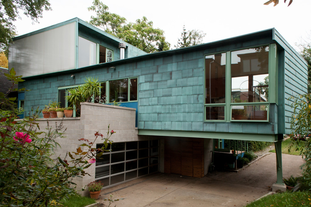 Photo of a blue contemporary two floor house exterior in Other.