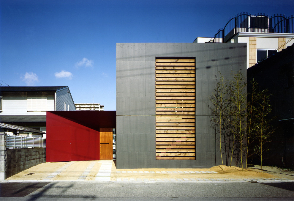 Стильный дизайн: черный, двухэтажный дом среднего размера в стиле модернизм с плоской крышей - последний тренд