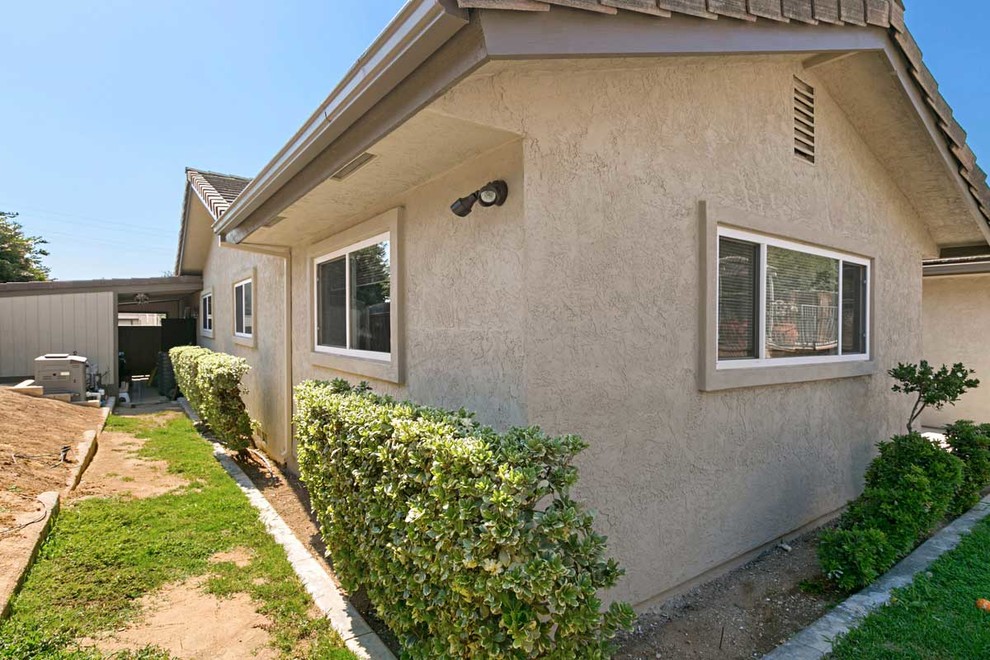 Side View of Taupe Stucco Siding Renovation Traditional Exterior San Diego by Classic