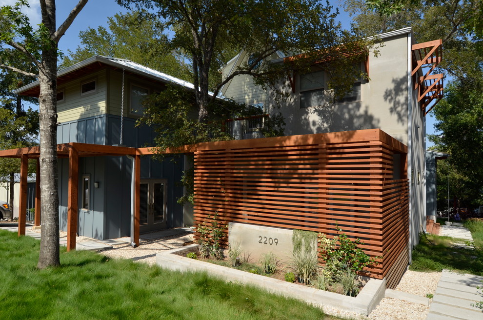 Trendy blue exterior home photo in Austin