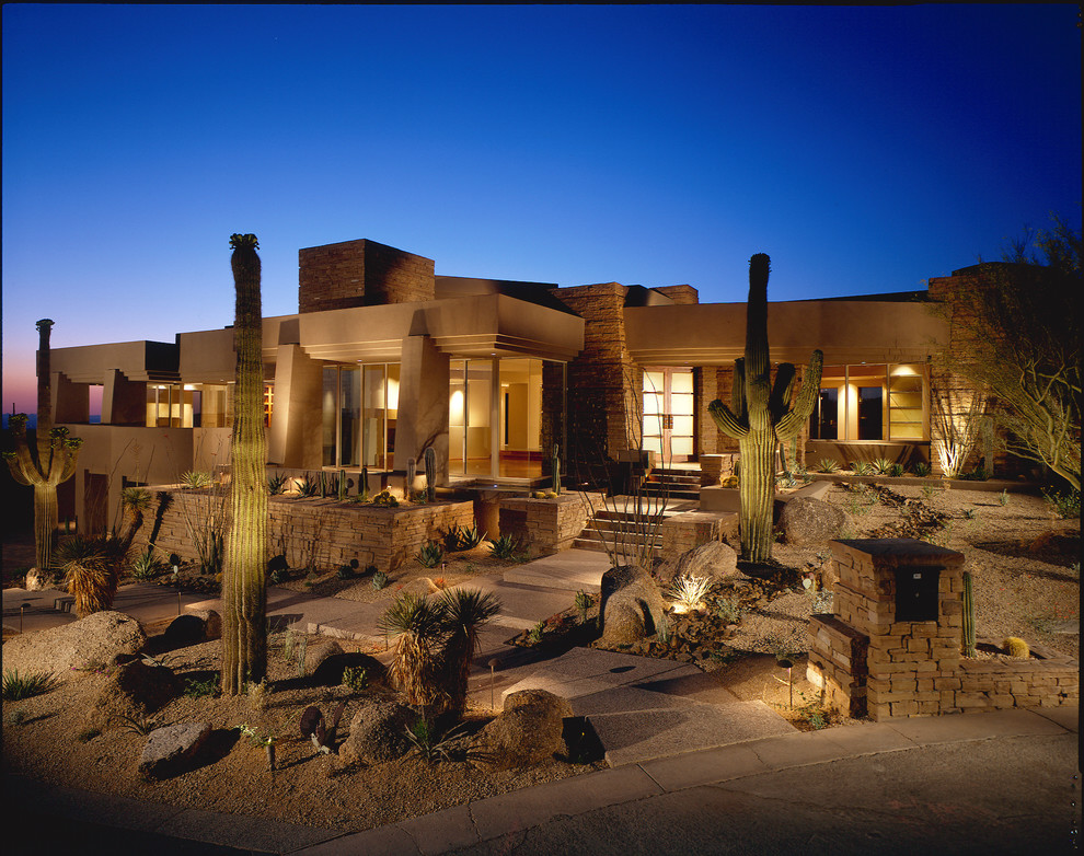 Inspiration for a southwestern beige one-story stone exterior home remodel in Phoenix