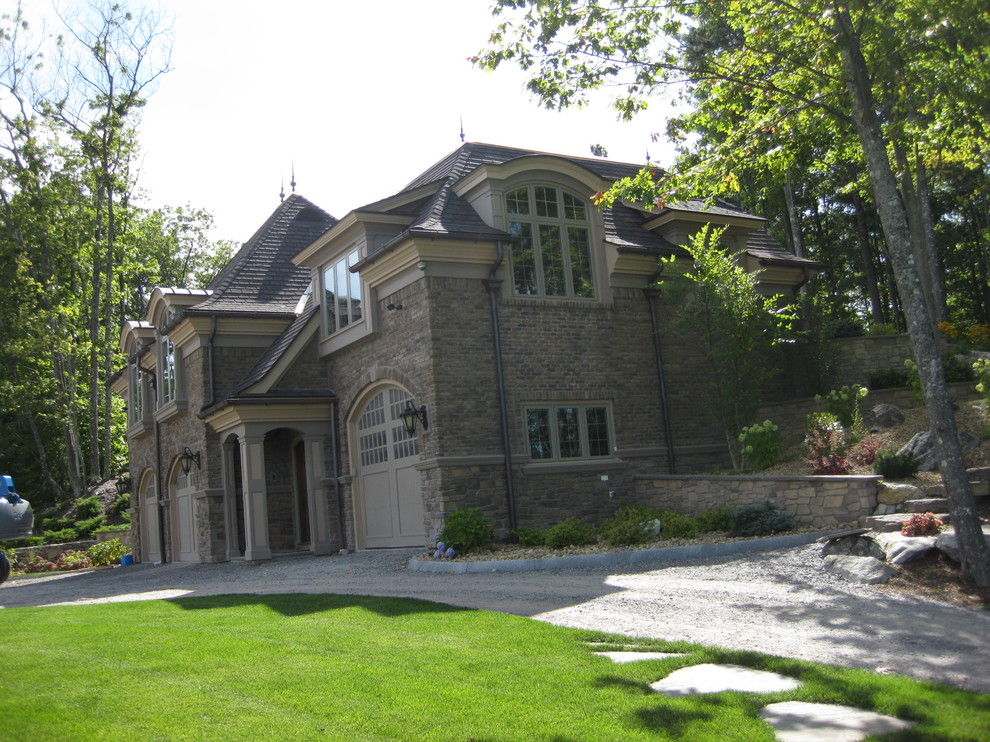 This is an example of an expansive and brown classic detached house in Boston with three floors, stone cladding, a pitched roof and a tiled roof.