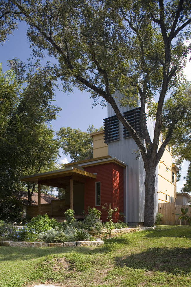 Inspiration for a mid-sized modern multicolored two-story mixed siding exterior home remodel in Austin