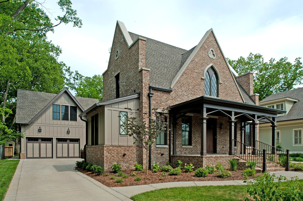Example of a classic two-story brick exterior home design in Nashville