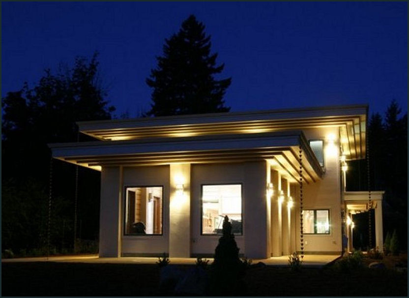 Aménagement d'une grande façade de maison marron rétro en panneau de béton fibré à un étage avec un toit plat.