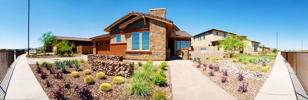 Mid-sized trendy brown one-story stone exterior home photo in Phoenix