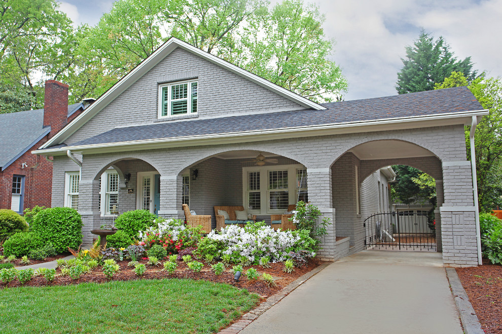 Inspiration for a craftsman gray two-story brick exterior home remodel in Charlotte