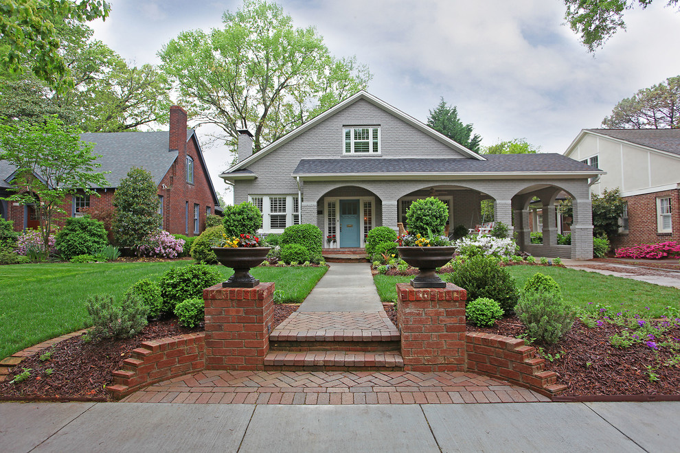 Photo of a gey classic two floor brick house exterior in Charlotte.
