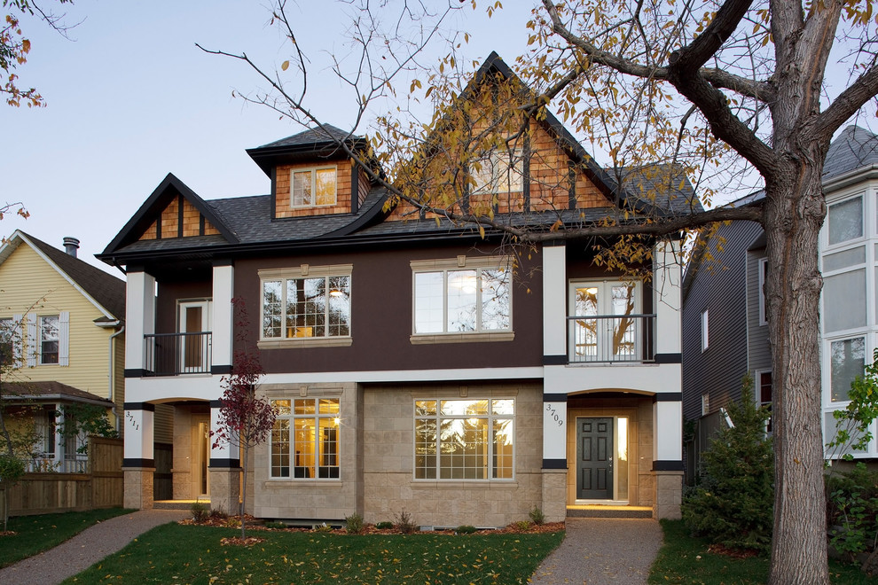 Traditional semi-detached house in Calgary with stone cladding.
