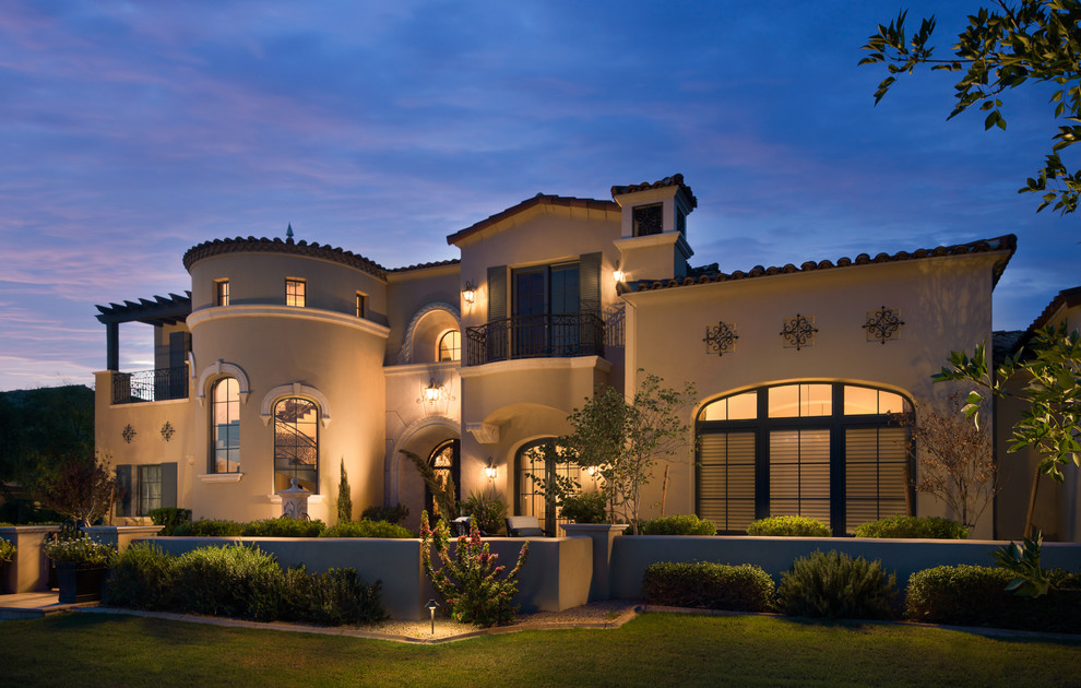 Huge transitional beige two-story stucco house exterior photo in Phoenix with a gambrel roof and a mixed material roof