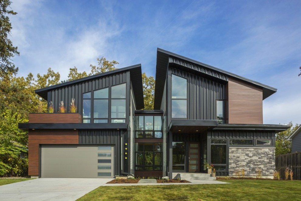 Inspiration for a modern two floor house exterior in Minneapolis.