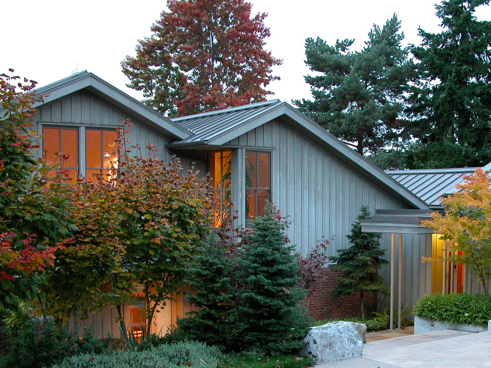 Photo of a contemporary house exterior in Seattle with wood cladding.