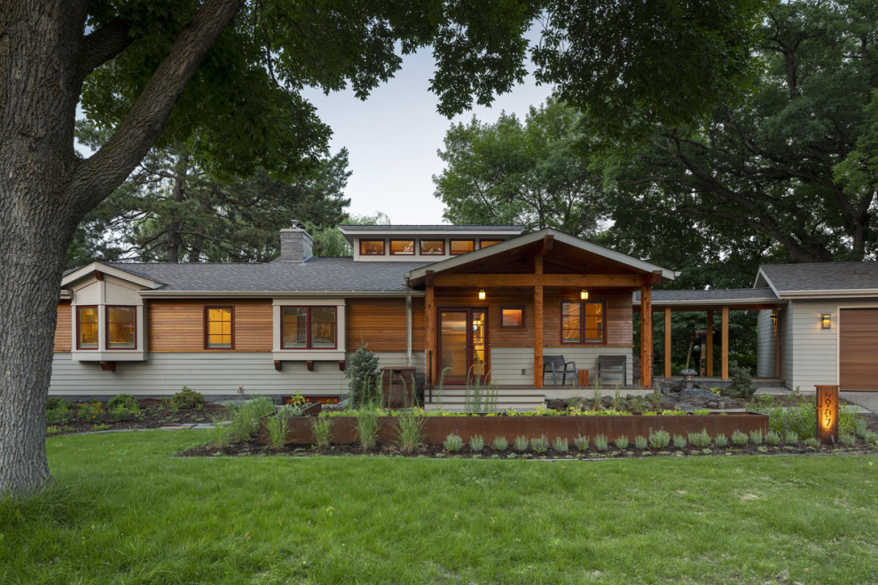 Inspiration for a timeless beige two-story wood house exterior remodel in Minneapolis
