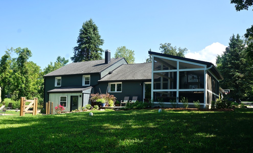 Example of a mid-sized minimalist gray two-story concrete fiberboard exterior home design in Philadelphia with a hip roof and a shingle roof