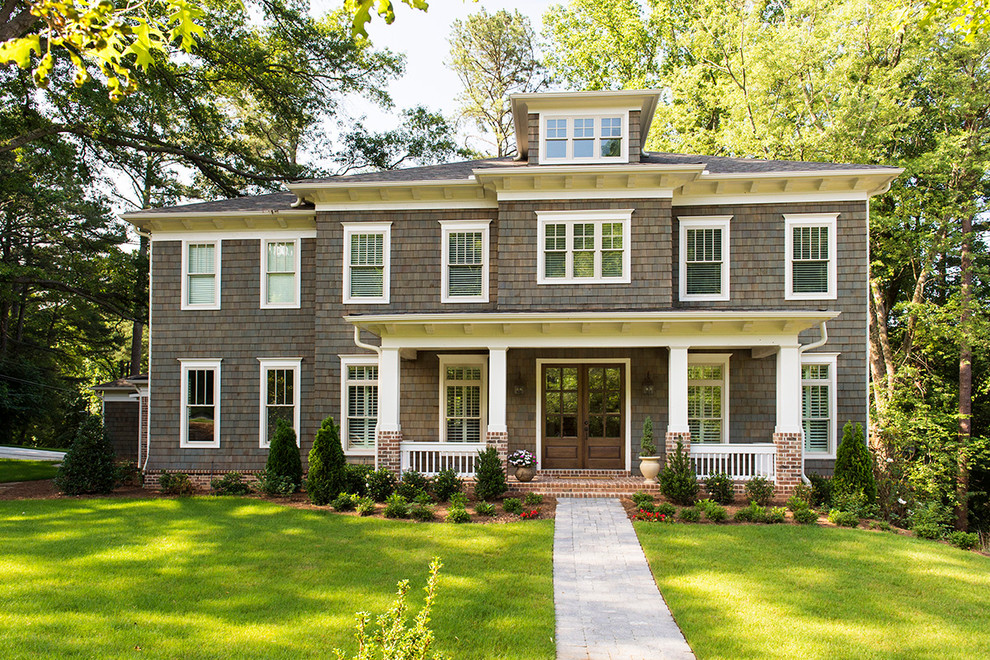 Mid-sized elegant brown three-story wood exterior home photo in Atlanta with a hip roof