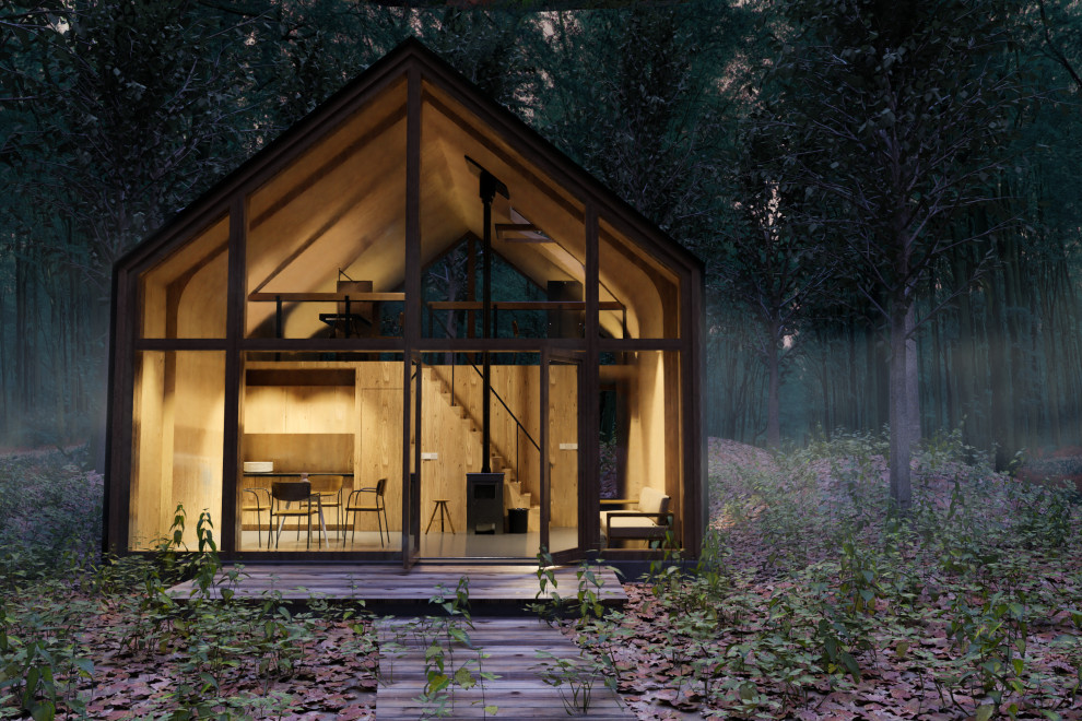 На фото: маленький, двухэтажный, черный мини дом в стиле модернизм с облицовкой из металла, односкатной крышей и металлической крышей для на участке и в саду с