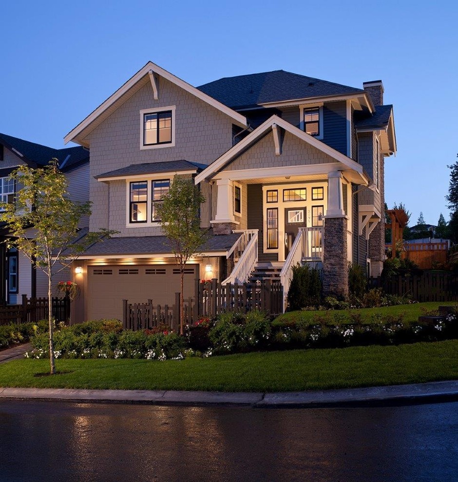 Inspiration for a medium sized classic two floor house exterior in Vancouver with wood cladding.