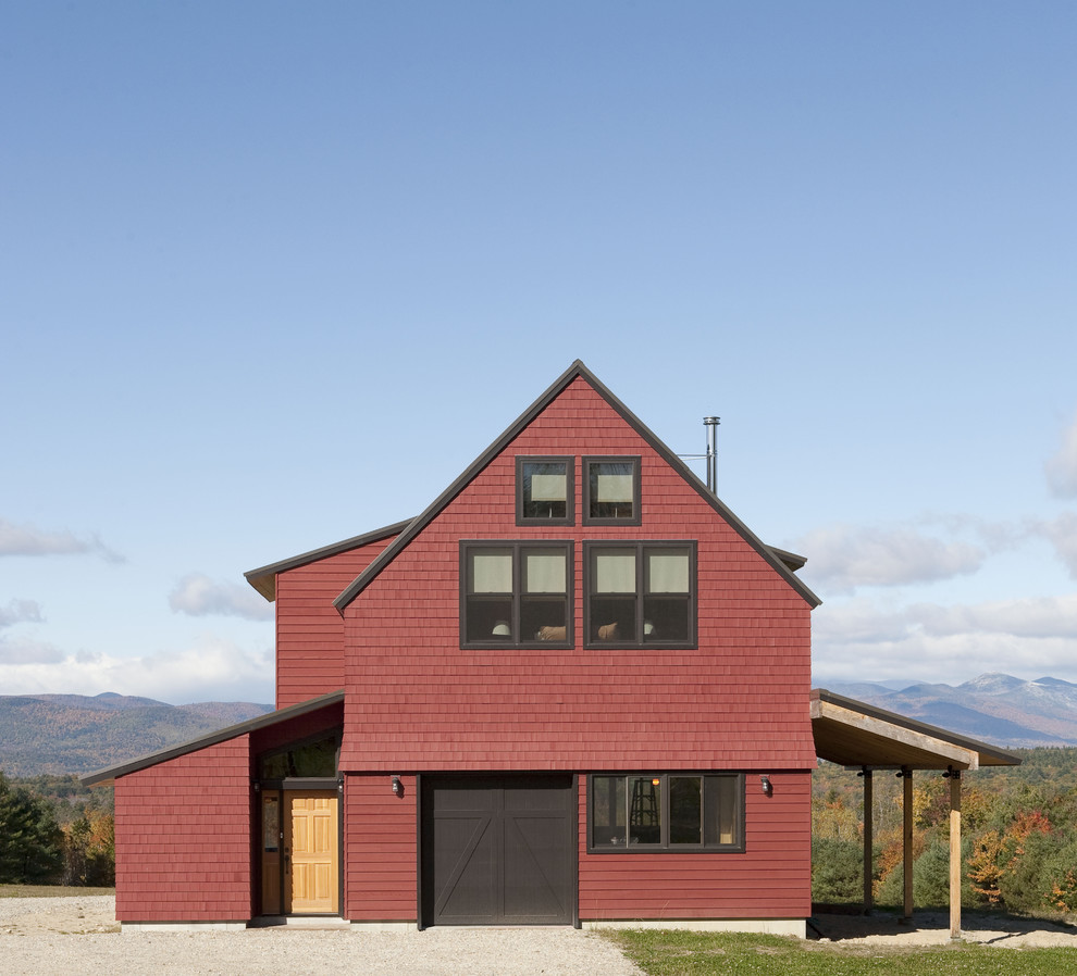 Inspiration for a medium sized and red country two floor house exterior in Portland Maine with wood cladding.