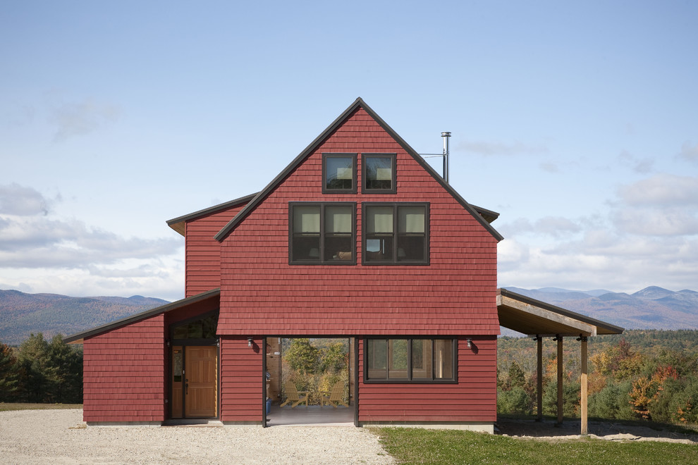 Large farmhouse red two-story wood exterior home idea in Portland Maine