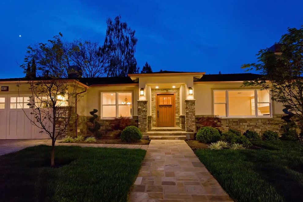 Inspiration for a large traditional bungalow render house exterior in San Francisco.