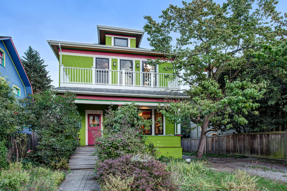 Ornate green two-story exterior home photo in Seattle
