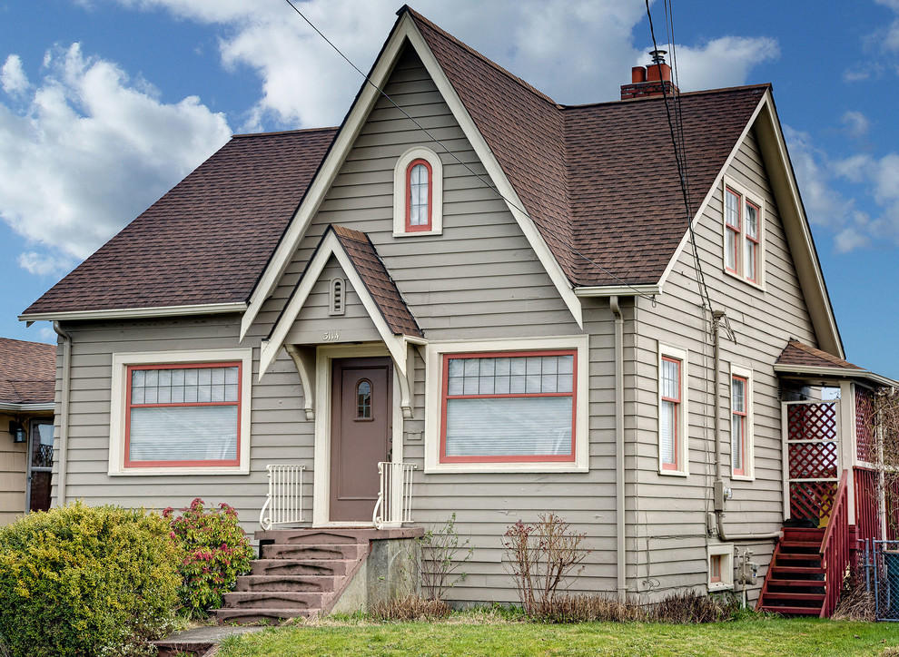 Design ideas for a medium sized and beige traditional two floor house exterior in Seattle with wood cladding.