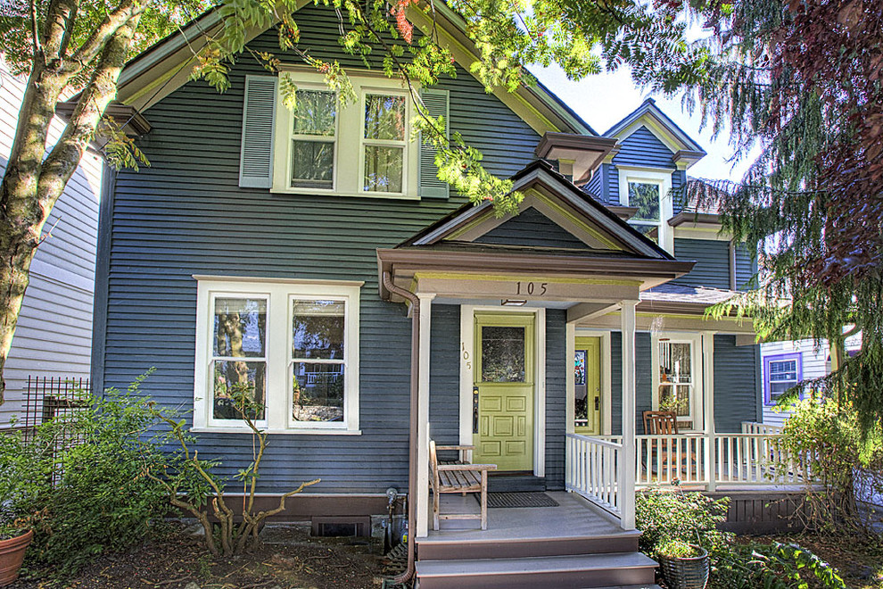 Design ideas for a large and blue farmhouse two floor house exterior in Seattle with wood cladding.