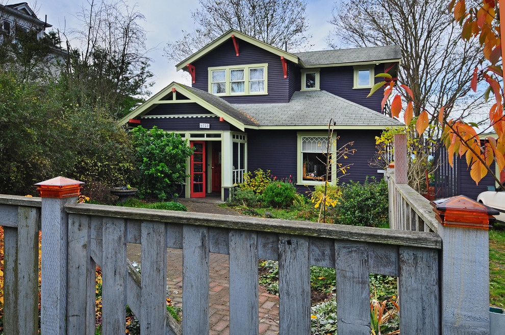 Inspiration for a large and blue traditional two floor house exterior in Seattle with wood cladding.
