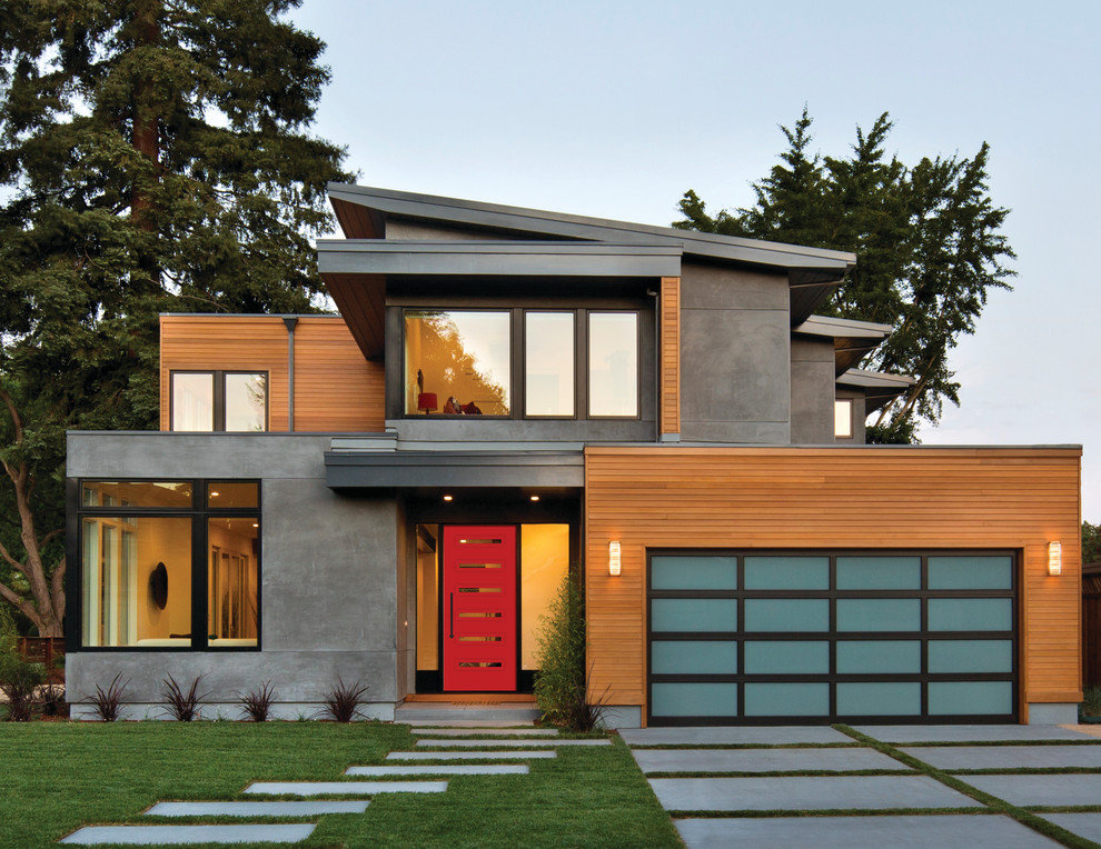 Photo of a large and multi-coloured contemporary two floor detached house in Vancouver with mixed cladding and a flat roof.