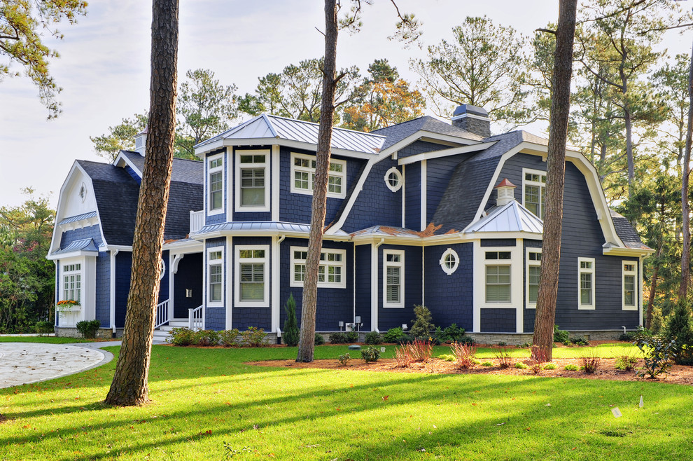 Example of a mid-sized beach style two-story wood exterior home design in Philadelphia