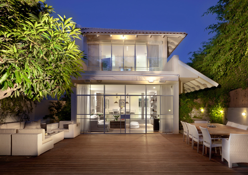 Medium sized contemporary two floor glass house exterior in Other.