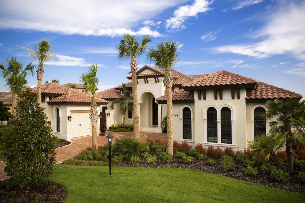 Example of a tuscan exterior home design in Tampa