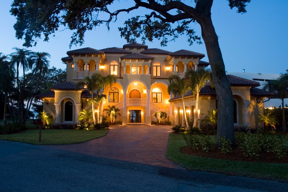 This is an example of a mediterranean house exterior in Tampa with three floors.