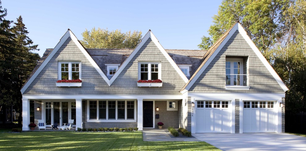 Inspiration for a large transitional two-story wood exterior home remodel in Minneapolis