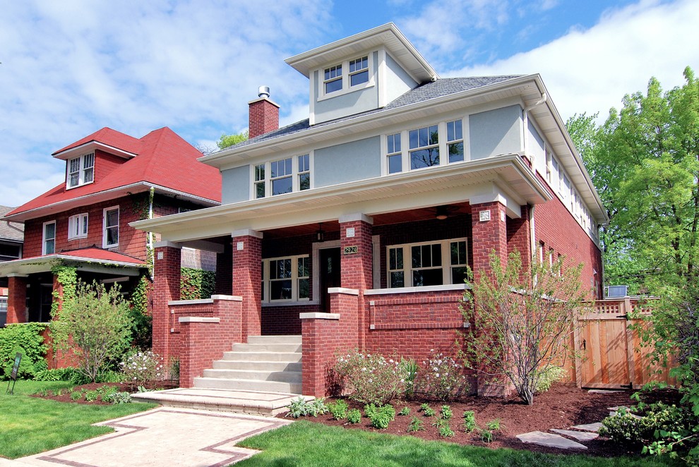 Photo of a medium sized traditional brick house exterior in Chicago with three floors.