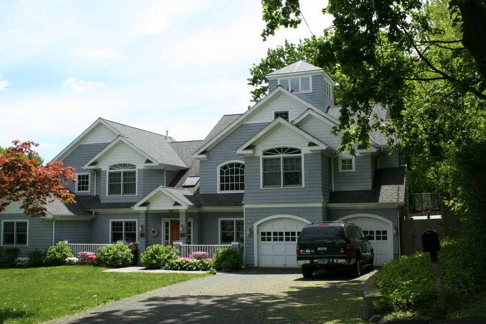 Design ideas for a large and blue classic house exterior in New York with three floors, wood cladding and a pitched roof.