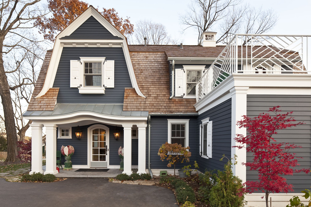 Example of a classic gray two-story exterior home design in Minneapolis