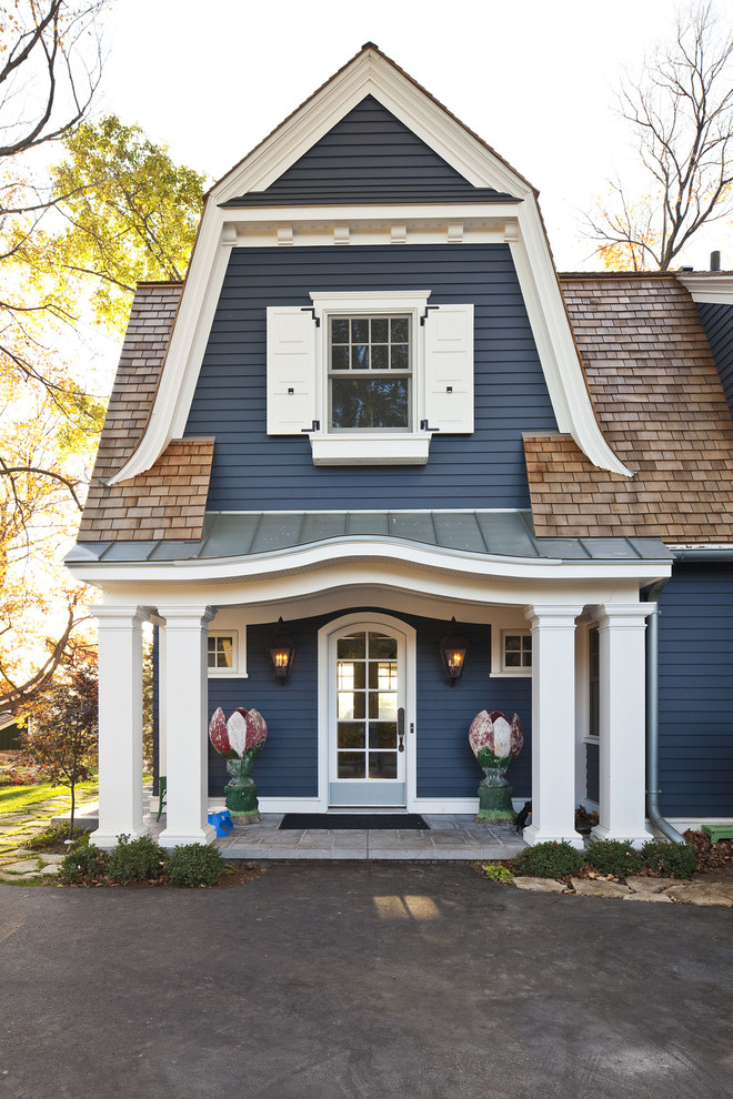 Inspiration for a timeless exterior home remodel in Minneapolis with a gambrel roof