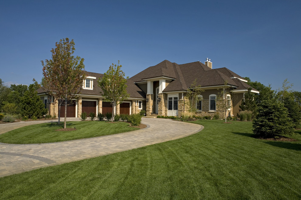 Example of a classic two-story exterior home design in Minneapolis