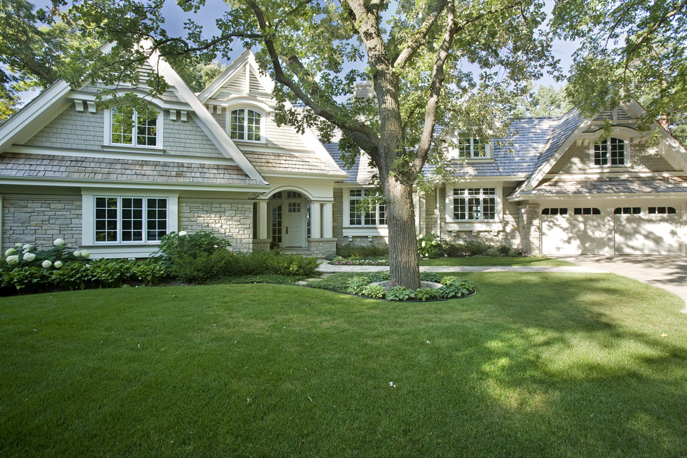 Example of a classic two-story exterior home design in Minneapolis