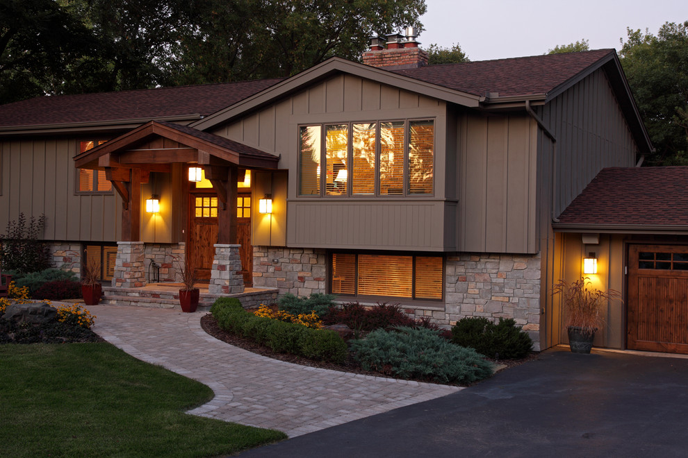 This is an example of a traditional house exterior in Minneapolis with stone cladding.