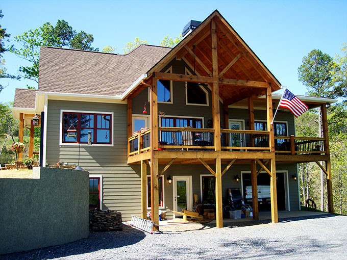 Photo of a medium sized and gey rustic two floor house exterior in Atlanta with vinyl cladding.